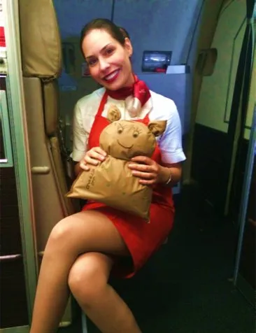 Jasna in cabin crew uniform holding the first Mimo